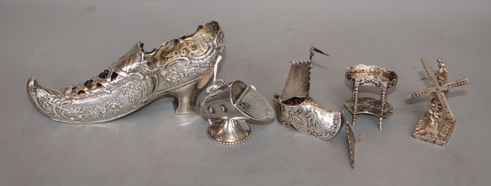 A German white metal shoe and four other miniature white metal items